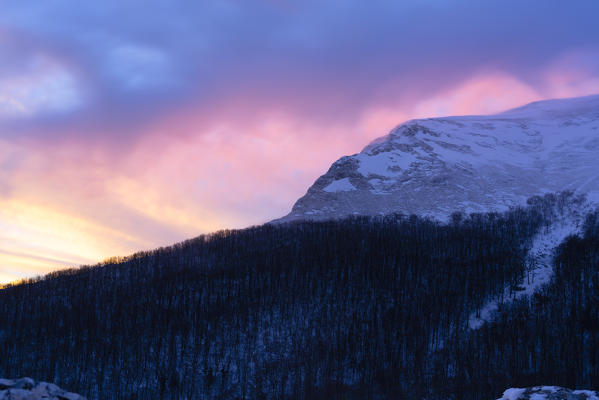 Italy, Umbria, Monte Cucco, Stormy sunrise in Winter