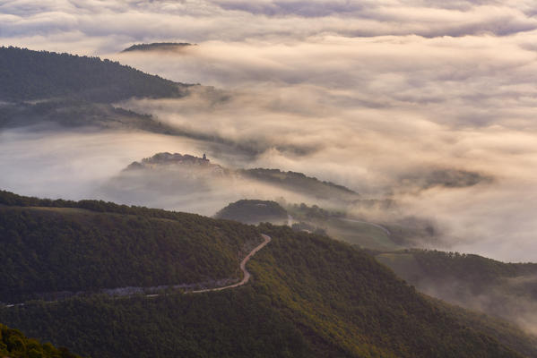 Italy, Umbria, Apennines, Monte Cucco Park, Village in the fog