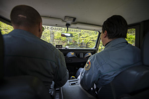 Two rangers in their cross-country car, Casentinesi Forests NP, Emilia Romagna district, Italy