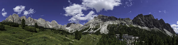 Panoramic view of the Firenze mountain hut and Odles mountain range in a sunny day of Summer, Dolomites, Italy
