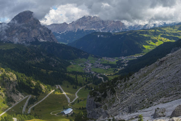 Aerial view of the town of Colfosco, Badia Valley in a cloudy day, Dolomites, Sudtirol, Italy