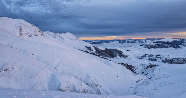 Italy, Umbria, Sibillini NP, Sunset on plateau Piano Grande of Castelluccio di Norcia  in Winter