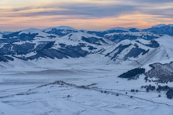 Italy, Umbria, Sibillini NP, Sunset on plateau Piano Grande of Castelluccio di Norcia  in Winter