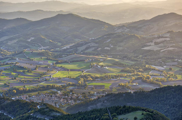 Italy, Umbria, Monte Cucco Park, Valley at sunset in Autumn