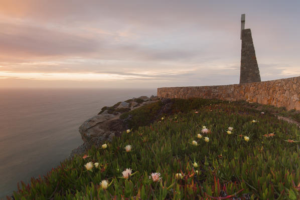 Sunset on the cape and lighthouse of Cabo da Roca overlooking the Atlantic Ocean Sintra Portugal Europe