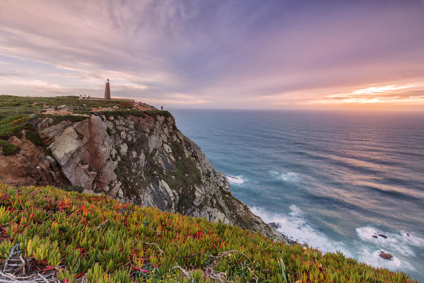 Sunset on the cape and lighthouse of Cabo da Roca overlooking the Atlantic Ocean Sintra Portugal Europe