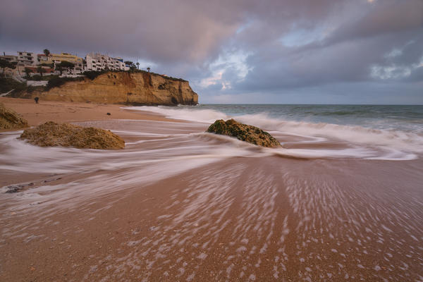 View of Carvoeiro village surrounded by sandy beach and clear sea at dusk Lagoa Municipality Algarve Portugal Europe