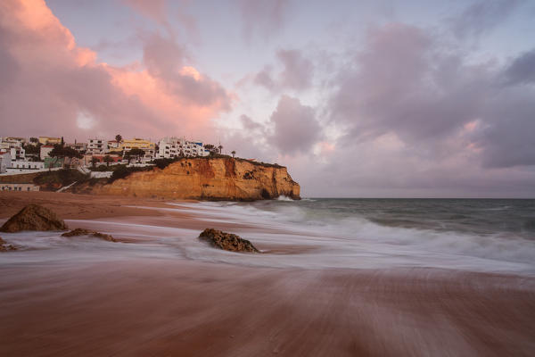 View of Carvoeiro village surrounded by sandy beach and clear sea at dusk Lagoa Municipality Algarve Portugal Europe