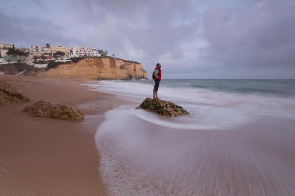 View of Carvoeiro village surrounded by sandy beach and clear sea at dusk Lagoa Municipality Algarve Portugal Europe