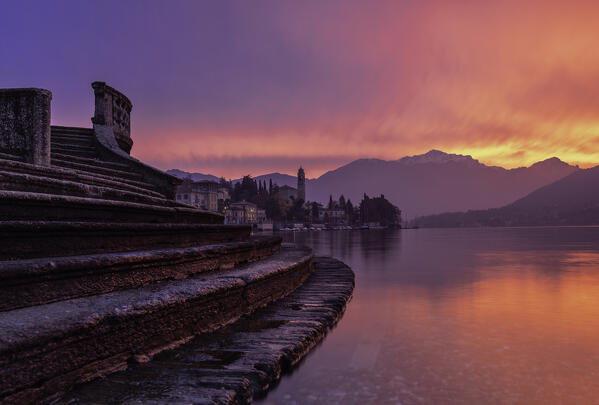 Burning sky at dawn in tremezzina, during a green way trekking, tremezzo, como district,lombardy,italy, europe