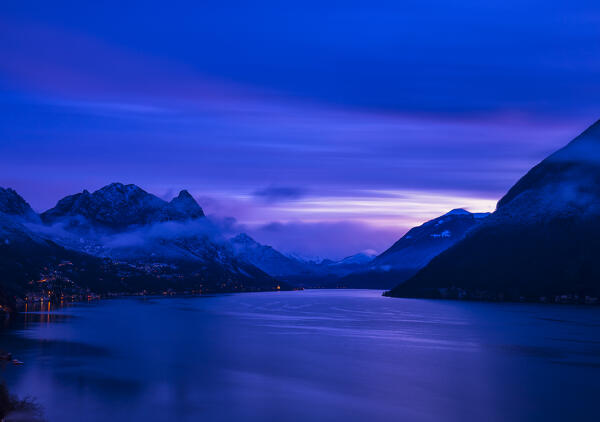 Blue sky at dawn over lake lugano after a snowfall, in background monte Legnone and the mountain of lake Como, Italian switzerland border,Gandria,ticino district,Lugano,Switzerland, europe