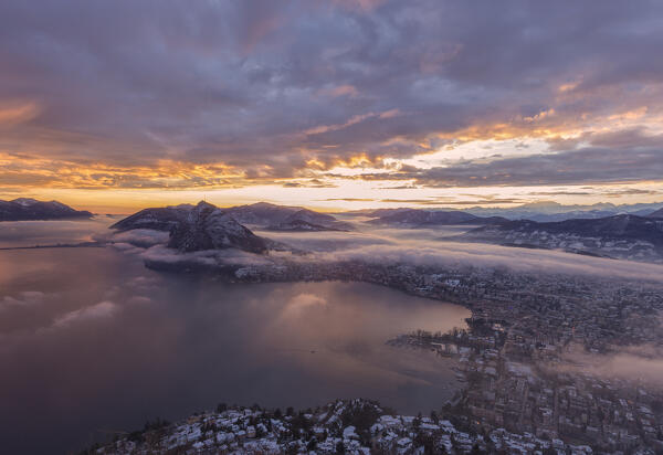 Lugano city and Lake Lugano at dawn after snowfall seen from the top of monte Bre, Canton of Ticino, Switzerland, Europe