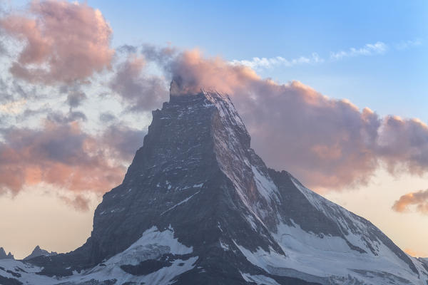 Matterhorn surrounded by clouds. Zermatt Canton of Valais Pennine Alps Switzerland Europe
