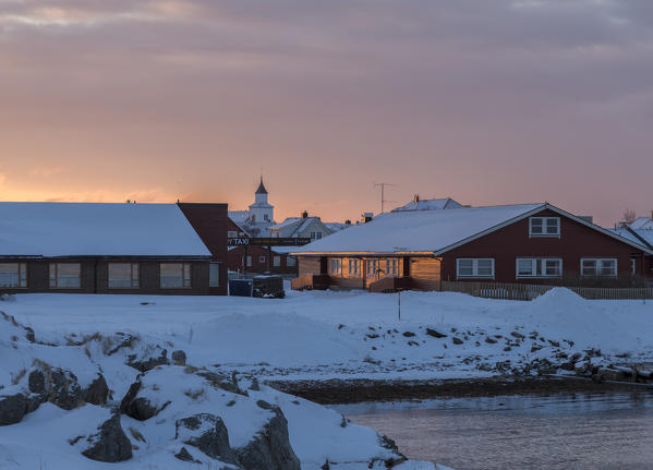 The colors of dawn frames the fishermen houses of the Andenes village in the Vesterålen district of Nordland county Norway Europe