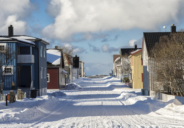  Main road in the norvegian winter between the fishermen houses of the Andenes village in the municipality of Andøy Vesterålen district of Nordland county Norway Europe