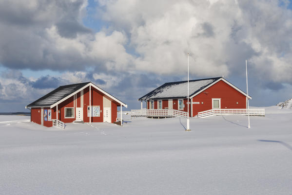 typical fishermen cabin surrounded by snow in Andenes village  in the municipality of Andøy Vesterålen district of Nordland county Norway Europe