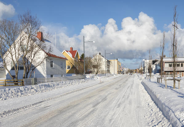  Main road in the norvegian winter between the fishermen houses of the Andenes village in the municipality of Andøy Vesterålen district of Nordland county Norway Europe 