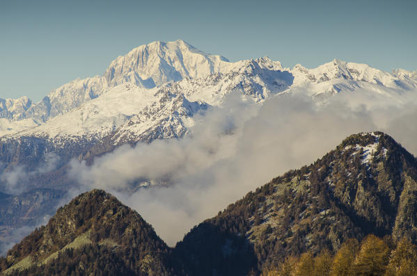 Mont Blanc it's rising, over the clouds and the ridges, in the panorama. (Val d'Ayas, Vallée d'Aoste, Italy)