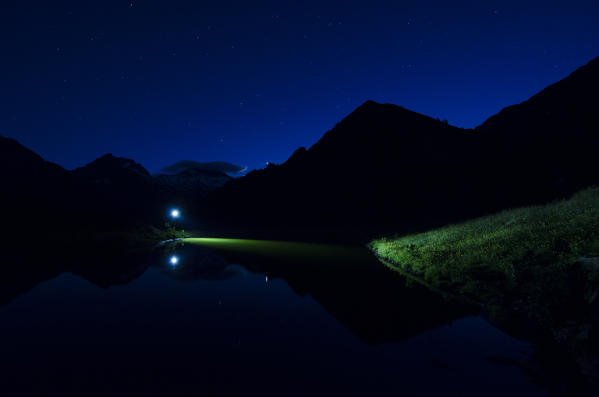 Lightgames near a little alpine lake (Val Soana, Gran Paradiso National Park, Piedmont, Italy)
