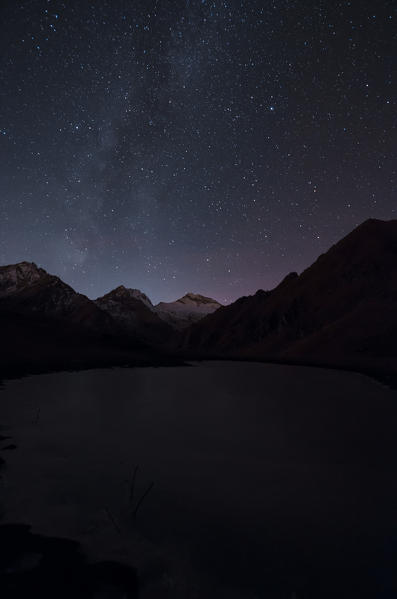Night on a little frozen alpine lake (Soana Valley, Gran Paradiso National Park, Piedmont, Italy)