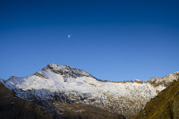 Torre di Lavina and moon (Soana Valley, Gran Paradiso National Park, Piedmont, Italy)
