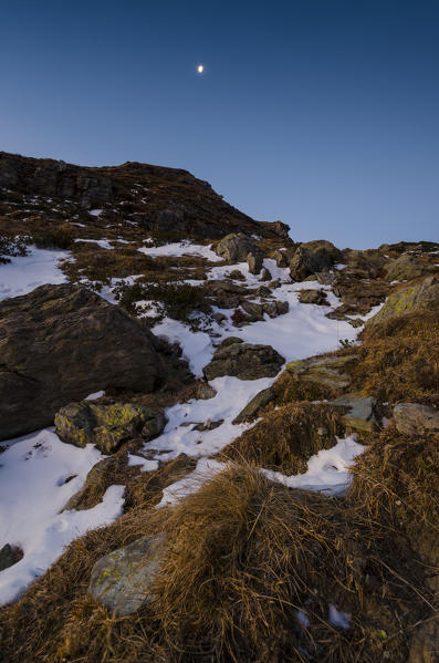 Moon over a pass (Soana Valley, Gran Paradiso National Park, Piedmont, Italy)