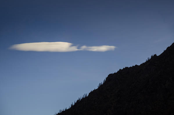Slope and cloud (Soana Valley, Gran Paradiso National Park, Piedmont, Italy)