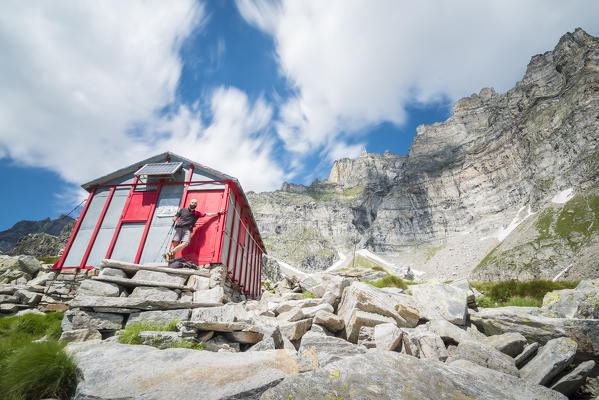 Alpinist at bivouac Combi Lanza, Alpe Devero, Ossola, Piedmont, Italian alps, Italy