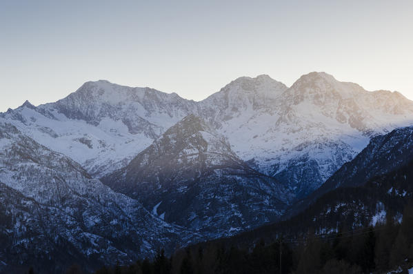 Sunset behind Weissmies, Lagginhorn and Fletchhorn, seen from Val Divedro, Ossola, Piedmont, Italian alps, Italy