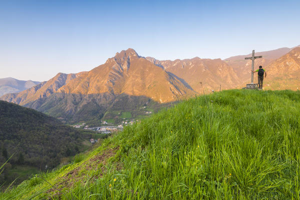Hiker on the summit of Crocetta, Val Brembana, Orobie alps, Italian alps, Province of Bergamo, Italy