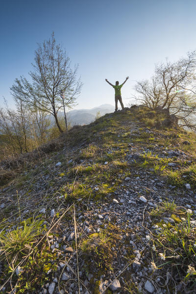 Hiker on the ridge of Pizzo del Sole, Val Brembana, Province of Bergamo, Orobie alps, Italian alps, Italy