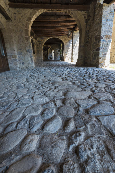 The ancient arcade of the market in Cornello dei Tasso, along Via Mercantorum, Val Brembana, Province of Bergamo, Orobie alps, Italian alps, Italy