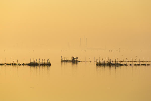 Venetian Lagoon and Marghera in the mist. Venice, Veneto, Italy.