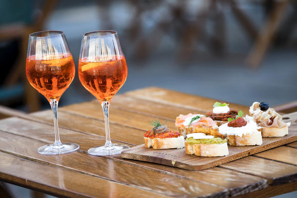 Spritz and cicchetti, classic venetian aperitif. Venice, Veneto, Italy, Europe.