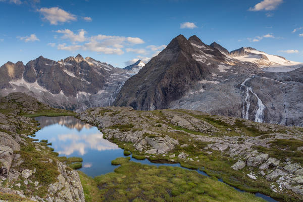 Genova valley, Adamello Brenta natural park, Trento province, Trentino Alto Adige, Italy. One of the many small lakes that surround the Mandrone refuge. In backgroud there are the three Lobbie and a tongue of Adamello glacier