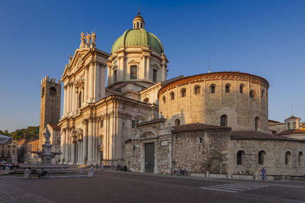 Brescia, Lombardy, Italy. The last rays of sunset illuminated the Brescia's cathedral under a blue sky