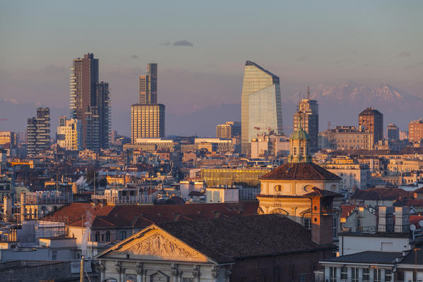 Milan, Lombardy, Italy. The skyscrapers of Milan city at sunset seen from the Cathedral