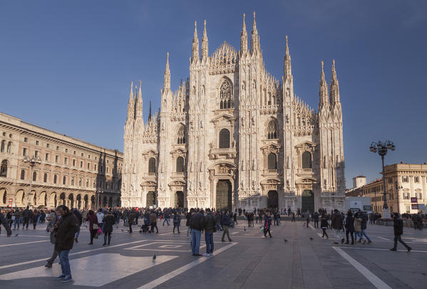 Milan, Lombardy, Italy. The Cathedral's square with people in a sunny day.