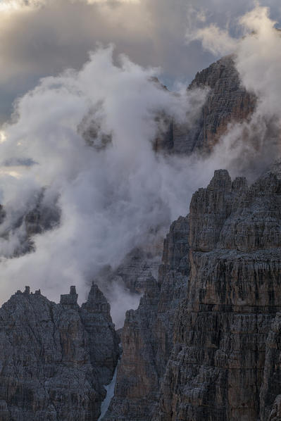 Bocca di Brenta, Brenta dolomites, Adamello Brenta natural park, Trentino, Italy. Fog into the valley