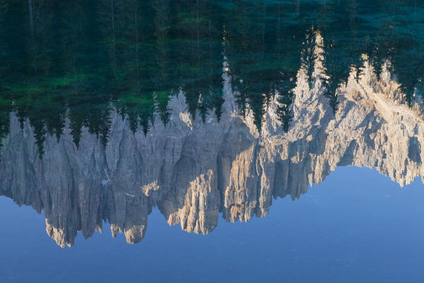Lake Carezza, Latemar group, Dolomites, Trento province, Trentino Alto Adige, Italy, Europe. Detail reflected of Latemar group on the lake