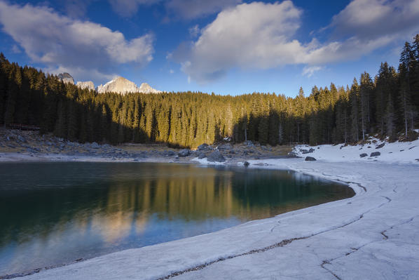 Lake Carezza, Ega valley, Nova Levante, Bolzano province, Dolomites, Trentino Alto Adige, Italy, Europe. Lake at thaw