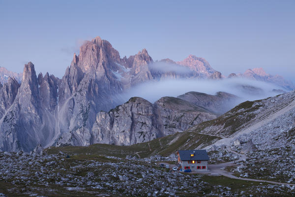 Tre Cime di lavaredo, Sexten Dolomites, Veneto. The refuge Lavaredo before the sunrise with Cadini of Misurina in background.