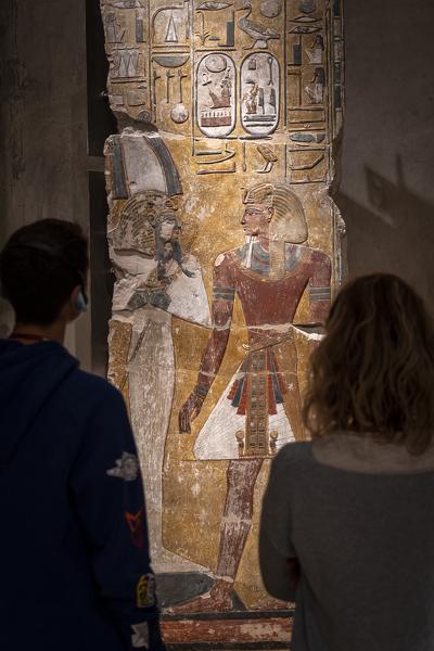 Two people admiring Relief of Pharaoh Seti in front of the God Osiris, Neues Museum, New Museum, Museum Island, Berlin, Germany, Europe, West Europe