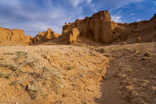 The orange rocks of Bayan Zag, commonly known as the Flaming Cliffs in the Gobi desert, Mongolia where important dinosaur fossils were found, Mongolia, Mongolian, Asia, Asian.