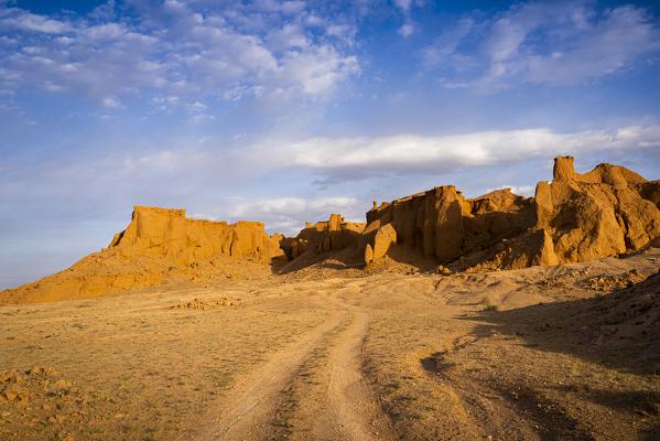 The orange rocks of Bayan Zag, commonly known as the Flaming Cliffs in the Gobi desert, Mongolia where important dinosaur fossils were found, Mongolia, Mongolian, Asia, Asian.