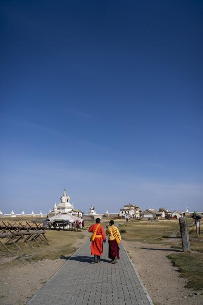 Two people at the Erdene Zuu Buddhist monastery, Kharkhorin, Ovorkhangai Province, Mongolia, Mongolian, Asia, Asian.
