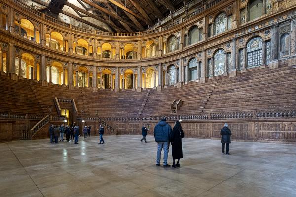 Tourists admiring Teatro Farnese (Farnese Theatre) within the building complex of Palazzo della Pilotta, Parma, Emilia Romagna, Italy, Europe.
