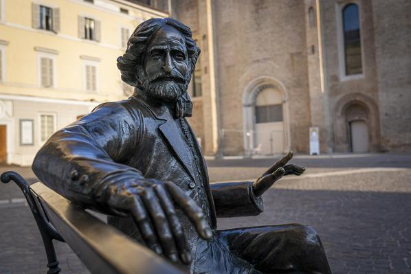 Statue of Giuseppe Verdi sitting on a bench in Piazza San Francesco. Parma, Emilia Romagna, Italy, Europe.
