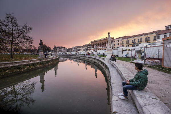 Padua, Veneto, North Italy, Europe. Relax in the Piazza Prato della Valle at dusk.