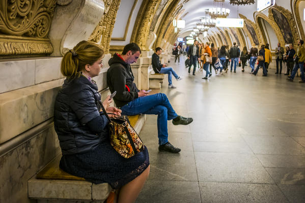 Moscow, Russia, Eurasia. People at the Kievskaya metro station.